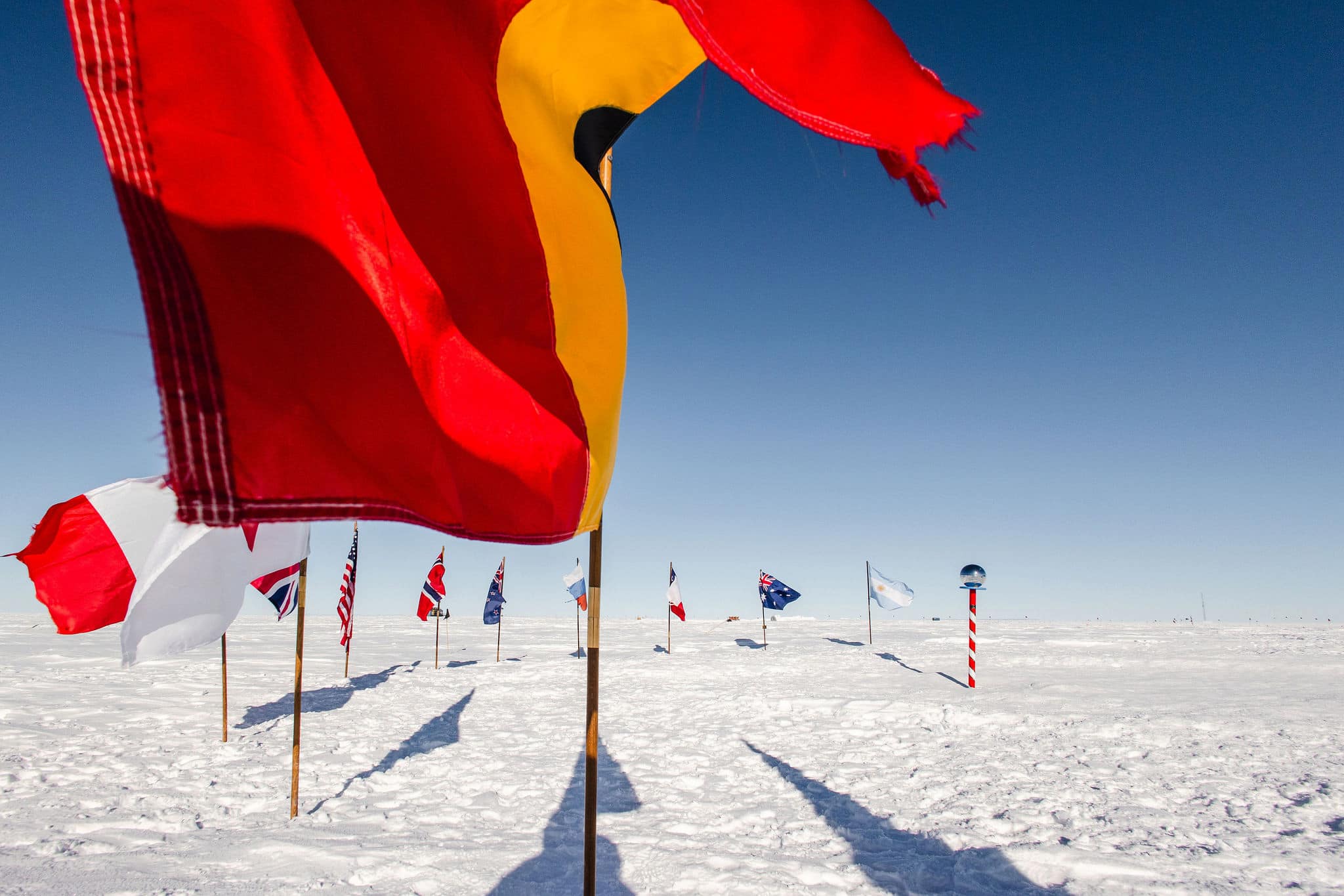 The Ceremonial South Pole, ringed by the flags of the Antarctic Treaty nations